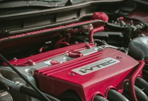 Detailed view of a Honda I-Vtec engine bay showcasing automotive engineering.